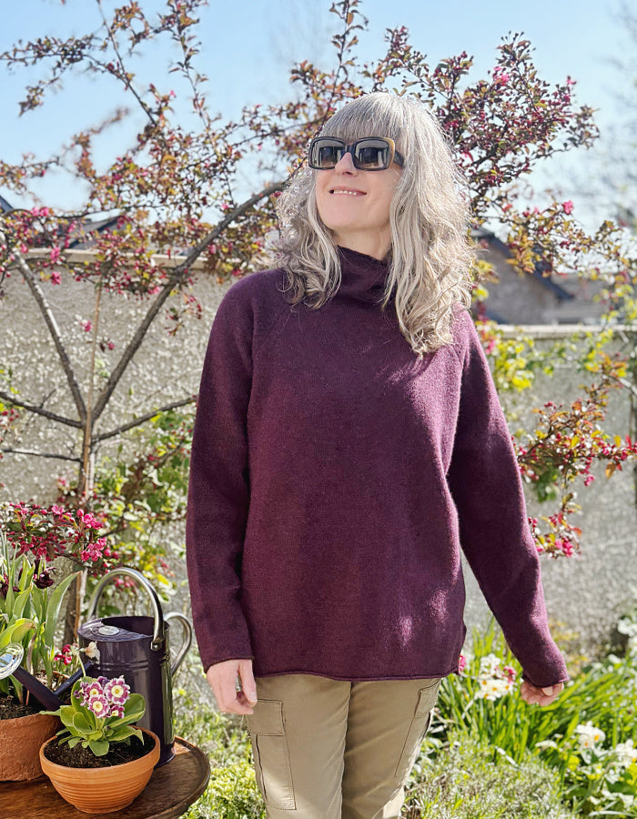 raglan sleeve lambswool sweater, loose fit with mock turtle neckline in black grape. made in Scotland