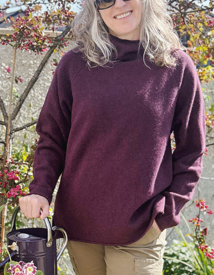 raglan sleeve lambswool sweater, loose fit with mock turtle neckline in black grape. made in Scotland