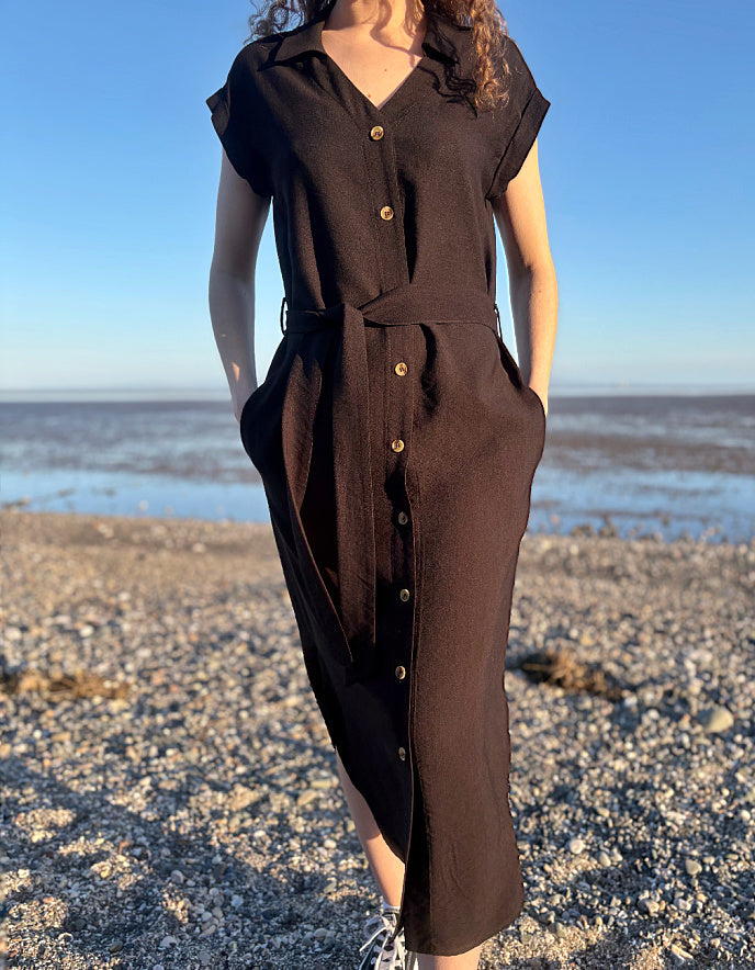 woman wearing black midi length shirt dress