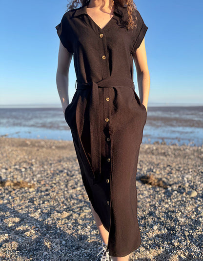 woman wearing black midi length shirt dress