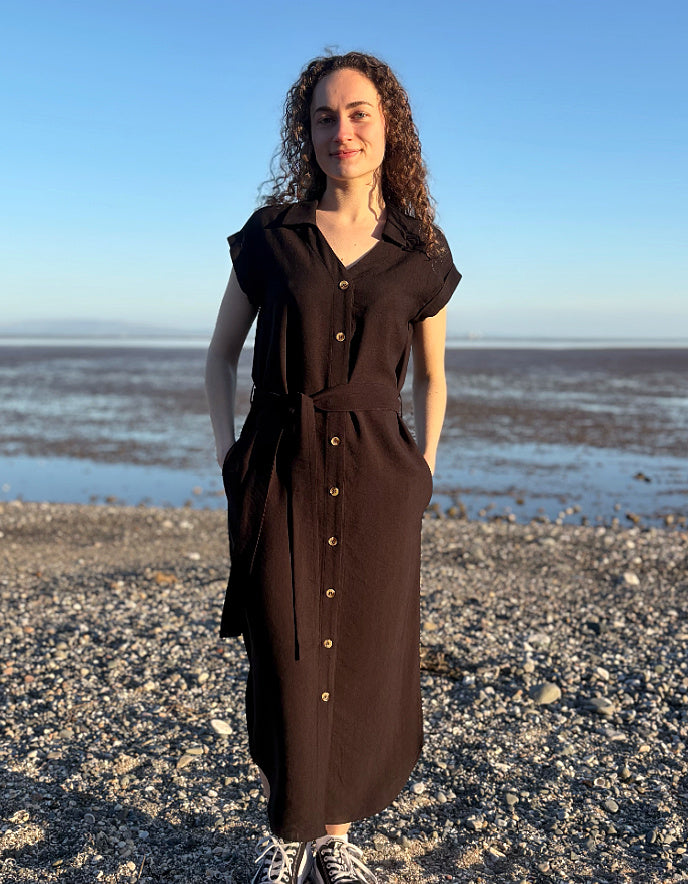 woman wearing black midi length shirt dress