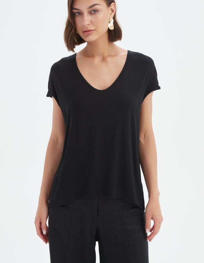 Woman wearing a black t-shirt on a white background