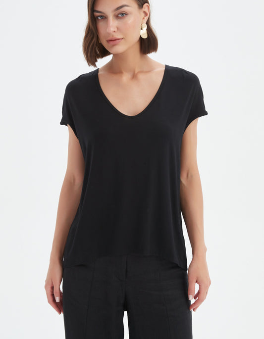 Woman wearing a black t-shirt on a white background