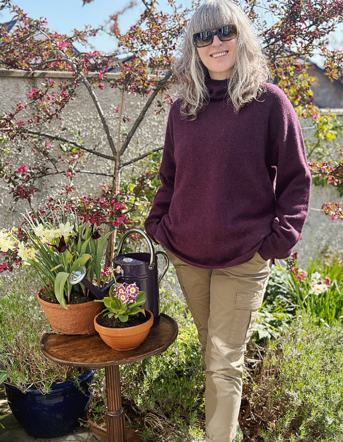 raglan sleeve lambswool sweater, loose fit with mock turtle neckline in black grape. made in Scotland
