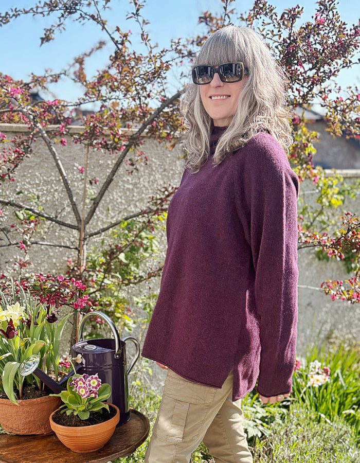 raglan sleeve lambswool sweater, loose fit with mock turtle neckline in black grape. made in Scotland
