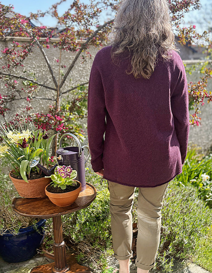 raglan sleeve lambswool sweater, loose fit with mock turtle neckline in black grape. made in Scotland