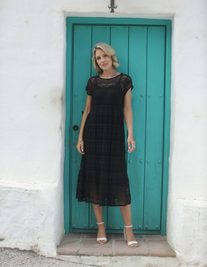 black lace midi length dress with underslip and capped sleeves