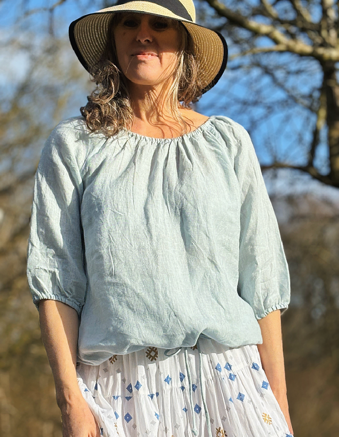 pale blue linen top with elasticated neckline so you can wear on or off the shoulder