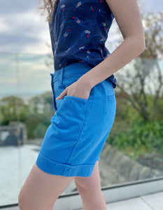 blue mid thigh length summer shorts with front and back pockets