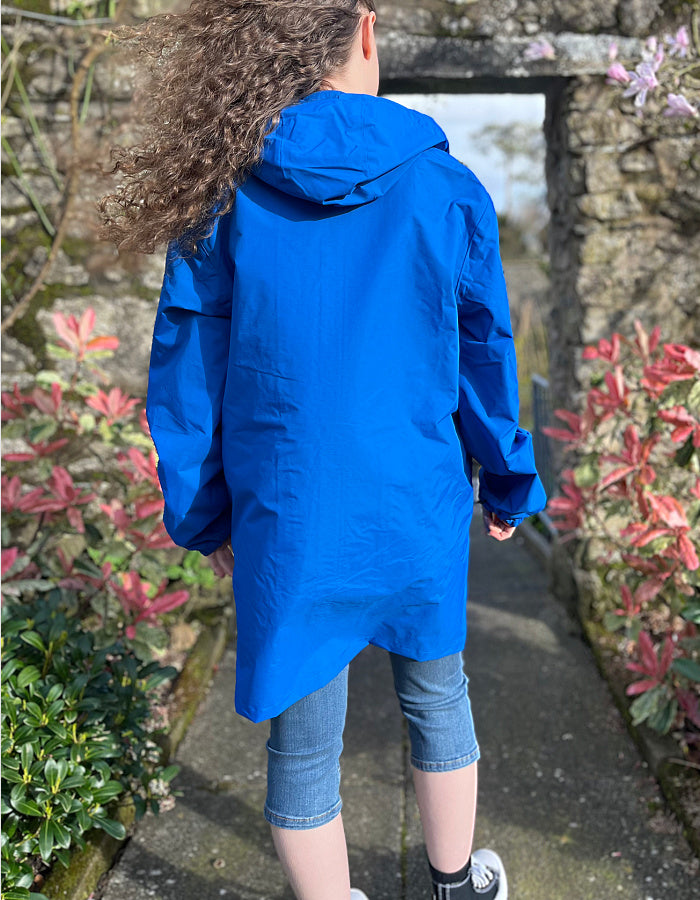 waterproof coat in cobalt blue, mid thigh length, hood and taped seams