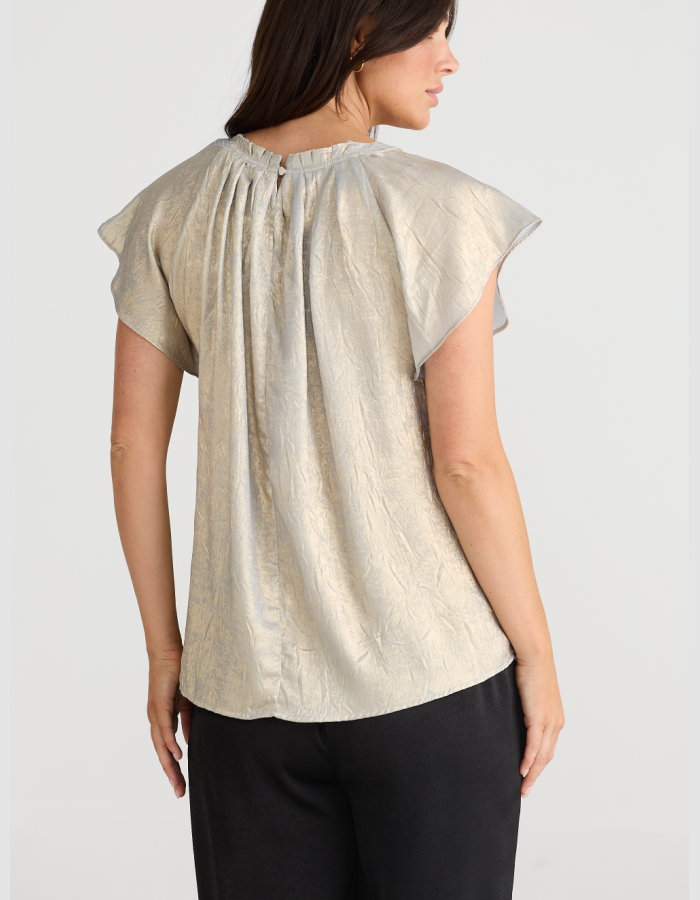 champagne coloured top with crew neck and fluted sleeves