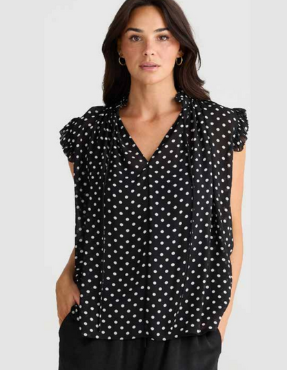 black and white polka dot chiffon sleeveless top with ruffle edged detail