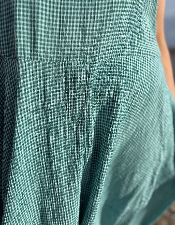 Close-up of green checkered fabric with a blurred background