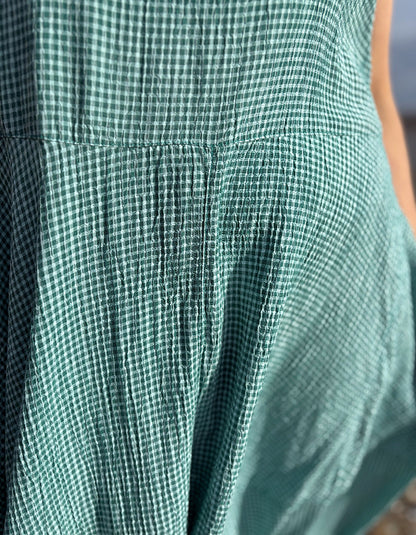 Close-up of green checkered fabric with a blurred background