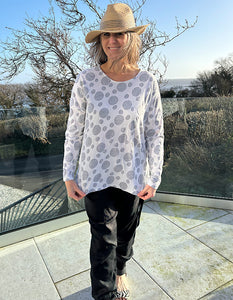 white cotton long sleeve top with scoop neckline with woven graphic grey bubble print all over