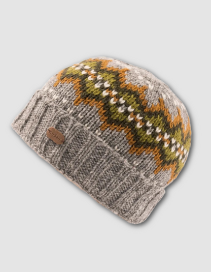 Knitted beanie with a patterned top on a light gray background
