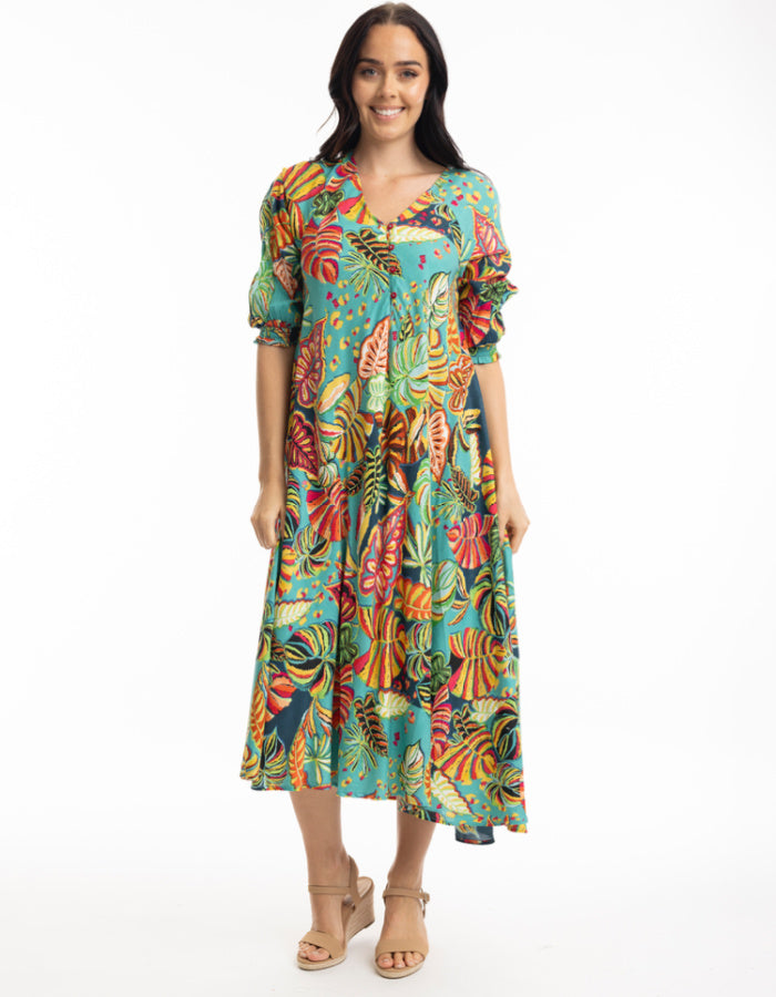 midi length swing shaped dress with elbow sleeve and v neckline in tropical print