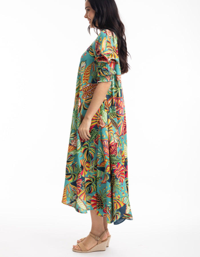 midi length swing shaped dress with elbow sleeve and v neckline in tropical print