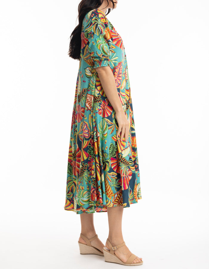 midi length swing shaped dress with elbow sleeve and v neckline in tropical print