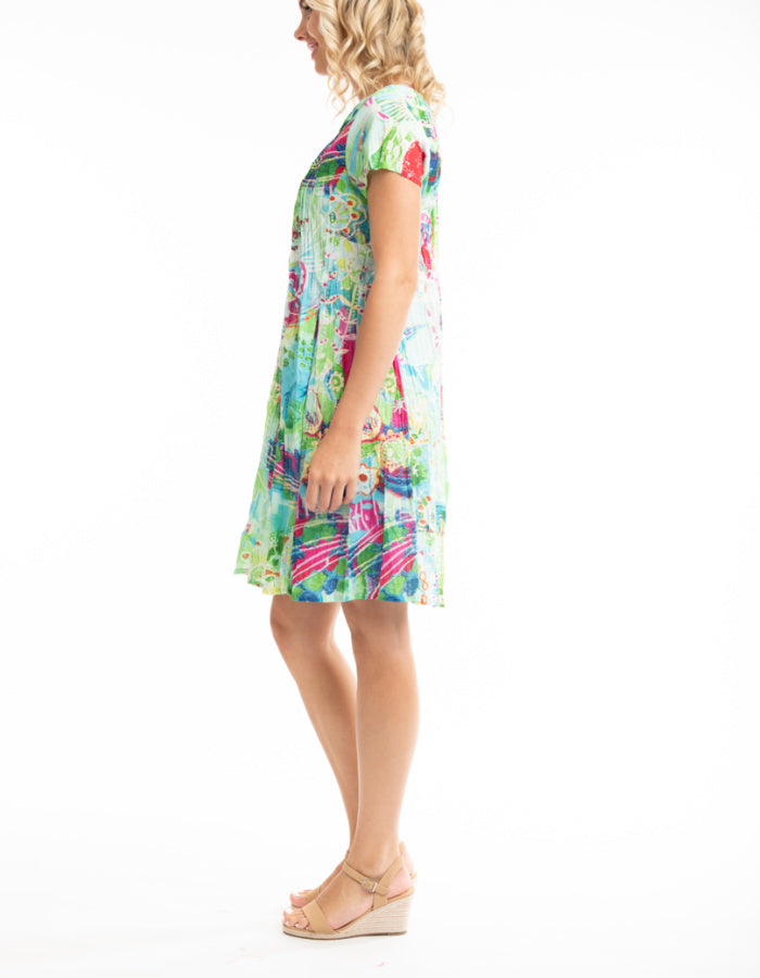 candy coloured loose fit knee length cotton dress with capped sleeves and pleated bodice