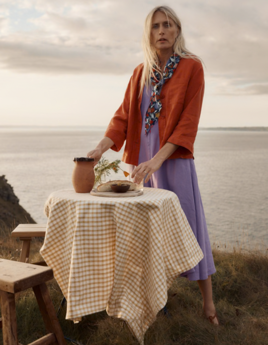 woman wearing a lilac linen tea dress style midi dress