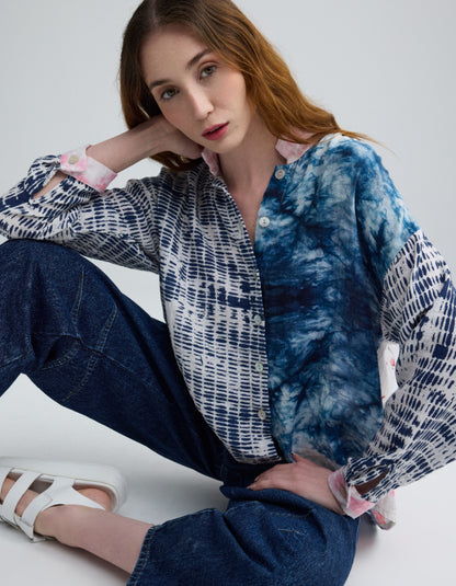 woman wearing blue cotton blouse with cherry blossom on the back