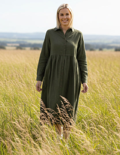 lady wearing olive green cord shirt dress in a field