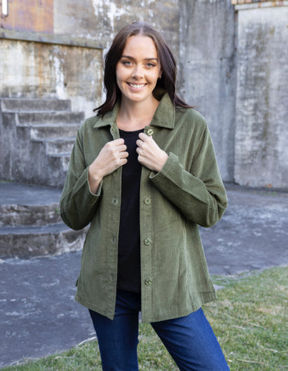 woman wearing olive green cord shirt stye jacket