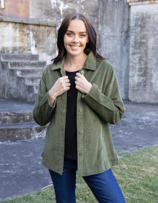 woman wearing olive green cord shirt stye jacket