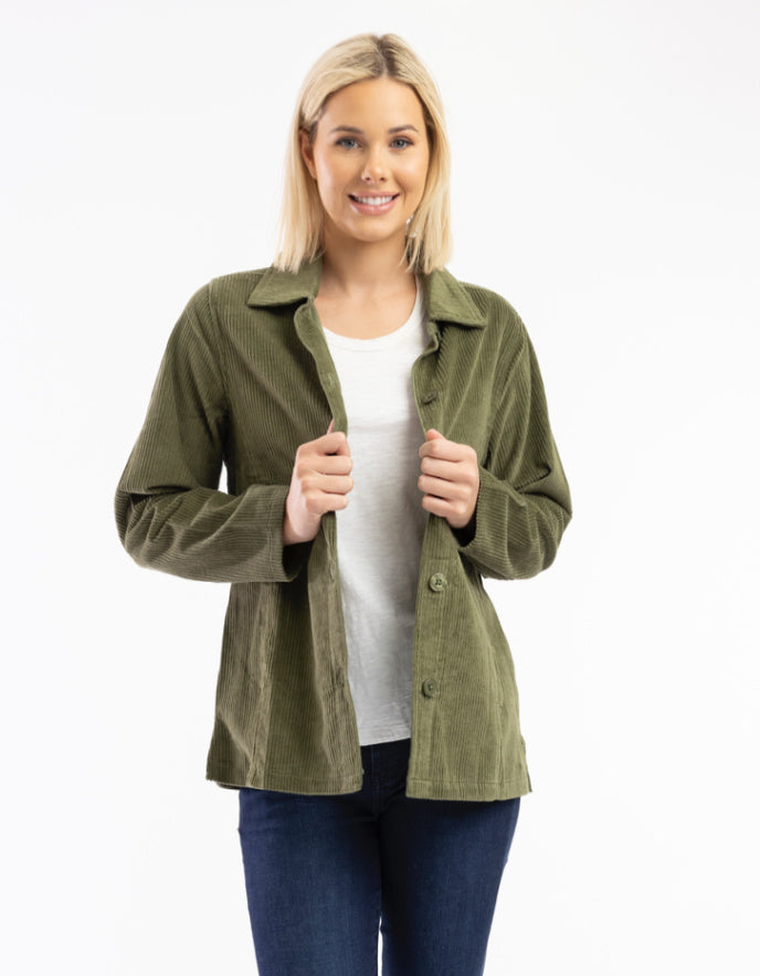 woman wearing olive green cord shirt stye jacket