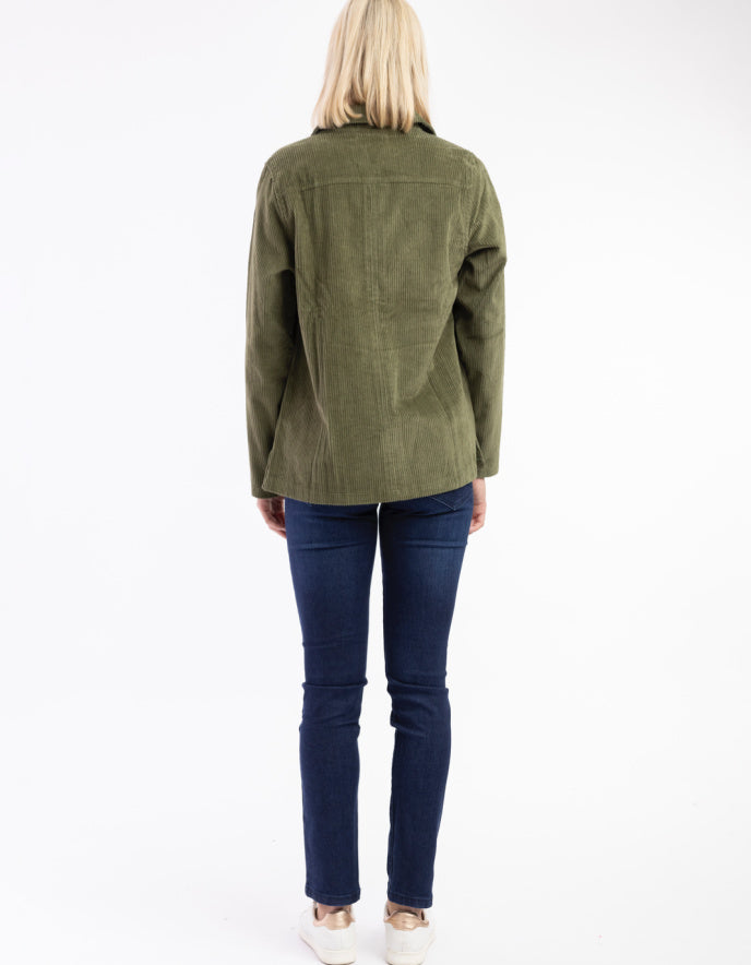 woman wearing olive green cord shirt stye jacket