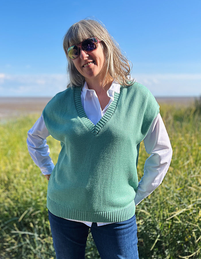 green cotton viscose tank top with ribbed edges. wear over shirt or t shirt