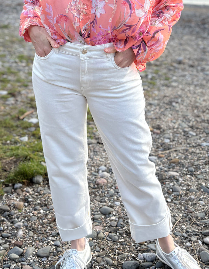 summer cropped cream jeans worn with a floral peach print cotton blouse