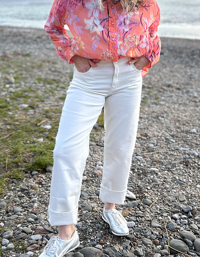 summer cropped cream jeans worn with a floral peach print cotton blouse