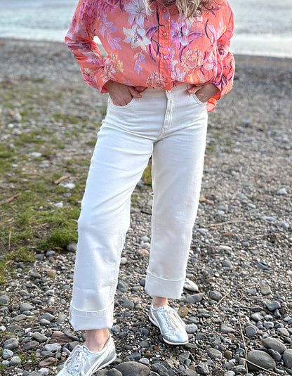 summer cropped cream jeans worn with a floral peach print cotton blouse