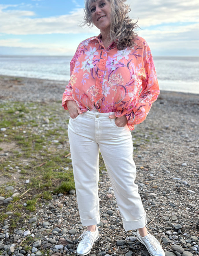 summer cropped cream jeans worn with a floral peach print cotton blouse