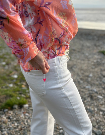 summer cropped cream jeans worn with a floral peach print cotton blouse
