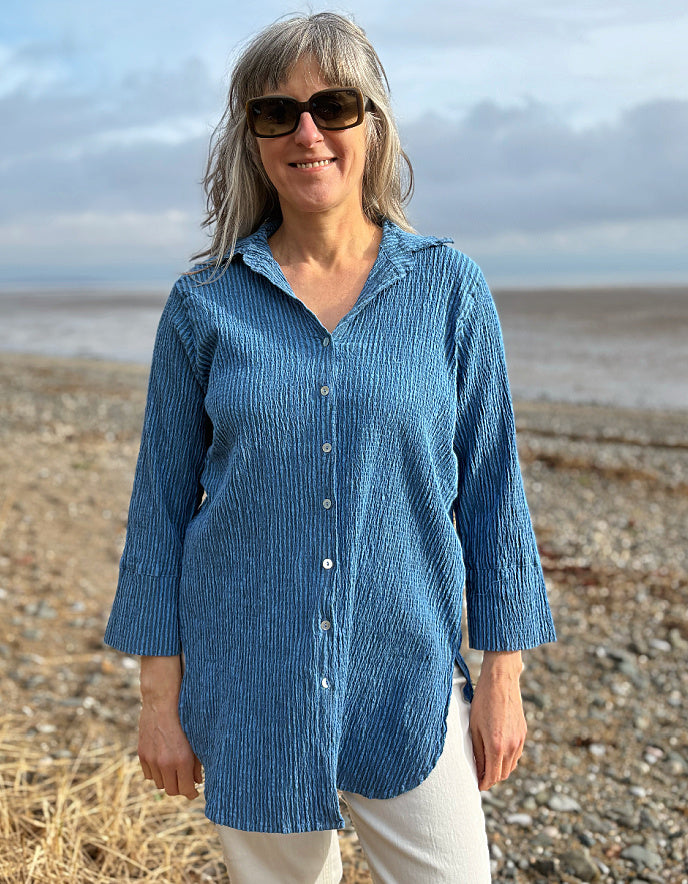 woman wearing blue striped loose fit shirt