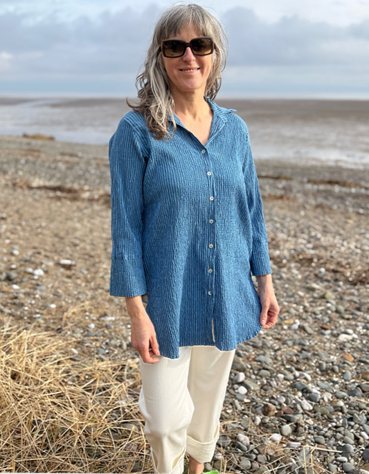 woman wearing blue striped loose fit shirt