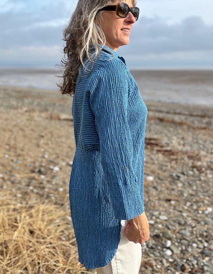 woman wearing blue striped loose fit shirt