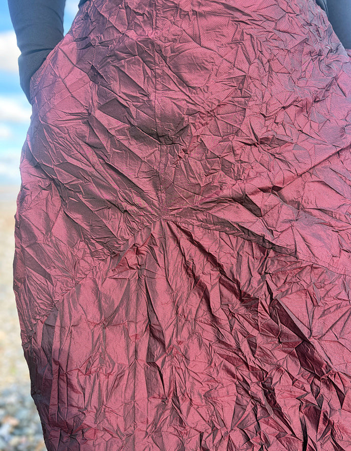 Close-up of a textured pink fabric with a blurred background