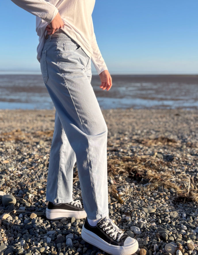 woman wearing powder blue barrel jeans