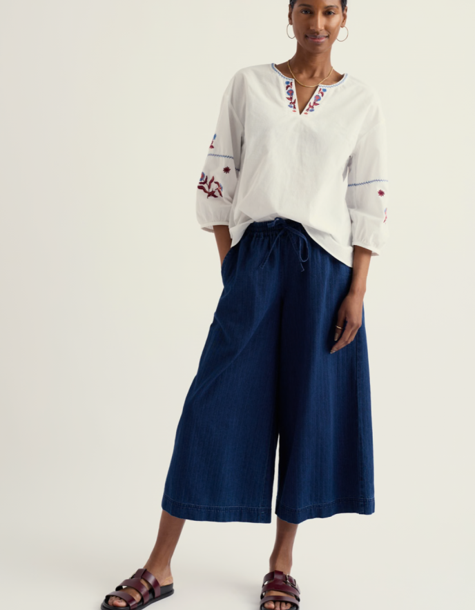 woman wearing wide leg denim culottes