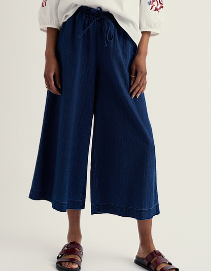 woman wearing wide leg denim culottes