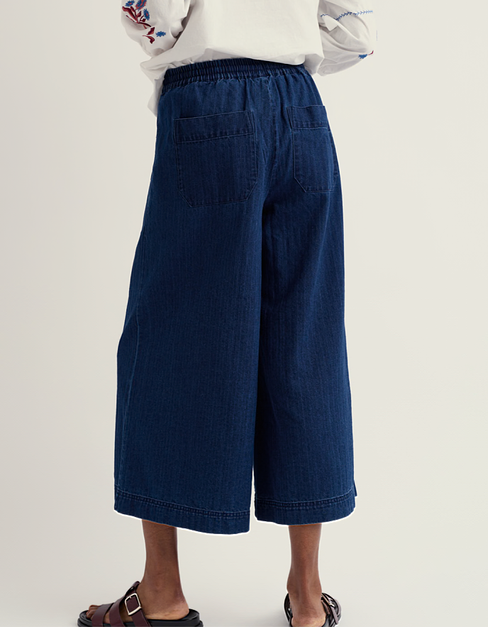 woman wearing wide leg denim culottes