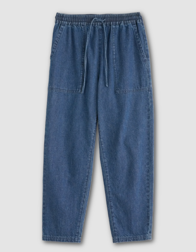 Blue denim pants on a light gray background