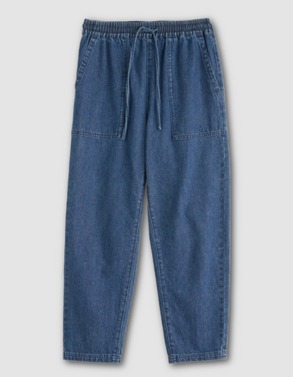 Blue denim pants on a light gray background