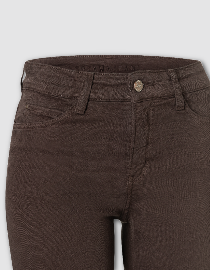 Close-up of dark brown textured denim jeans showing the waistband, button, belt loops, and front pockets against a light gray background.