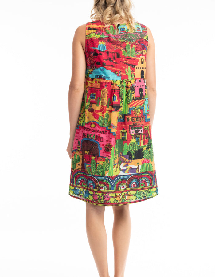 fully reversible A-line shift dress with one side colourful El Paso print and on reverse lime green print with cactus and sombrero print, pockets on both sides
