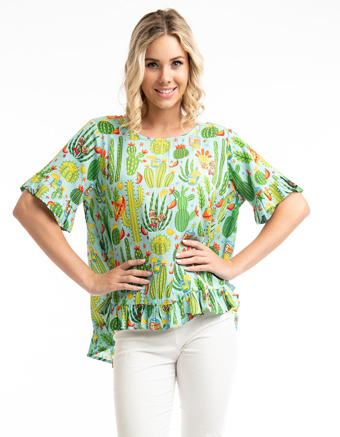 loose fit summer top with scoop neckline and fried edges in lime green with bright print with chillis and cacti and sombreros 